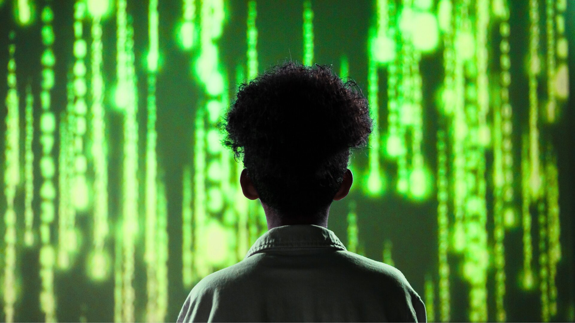 woman facing matrix wall